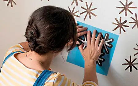 Instructions for painting a wall using stencils